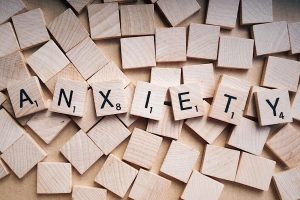 The word ANXIETY spelled on Scrabble tiles